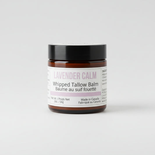 Bottle of Lavender Calm whipped tallow balm with light gray studio background